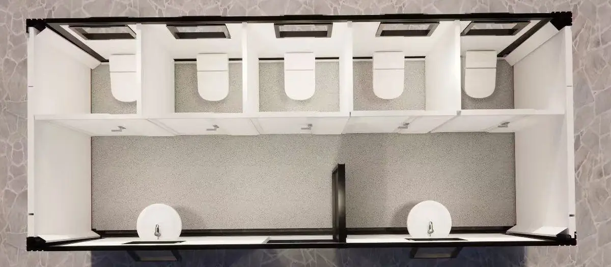 Vista superior en 3D de un módulo sanitario con cinco inodoros en boxes y dos lavatorios